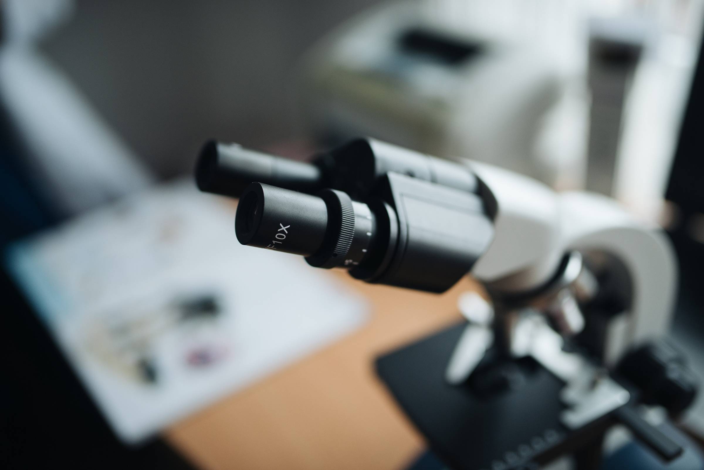 The ocular lenses of a laboratory microscope photographed in close-up.